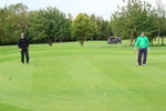Pop Robson and John Craggs lining up putts on the 5th green